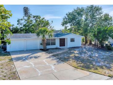 Charming single-story home features a well-manicured front yard and attached two-car garage, all freshly painted and inviting at 4907 4Th Avenue Nw Cir, Bradenton, FL 34209