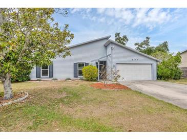 Charming single-Gathering home featuring a well-maintained lawn and an attached two-car garage at 8160 Glenbrooke Ct, Sarasota, FL 34234