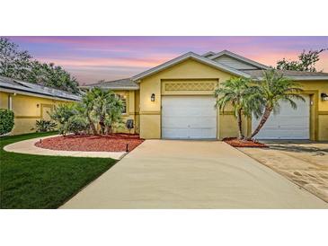 Charming home featuring a well-manicured lawn, lovely landscaping and an attached two car garage at 203 28Th W St, Palmetto, FL 34221