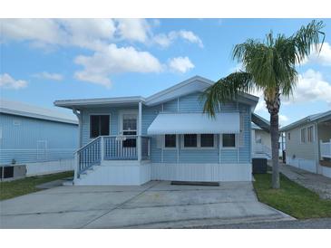 Charming light blue single-story home with well-maintained yard and white trim at 3333 26Th E Ave # 1132, Bradenton, FL 34208