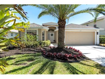 Charming single-story home with well-manicured landscaping and a two-car garage at 315 Heritage Isles Way, Bradenton, FL 34212
