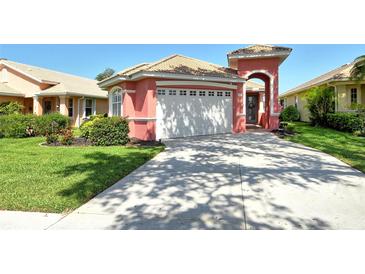 Charming single-Gathering home with a well-maintained lawn, lovely landscaping, and a two-car garage at 4322 Reflections Pkwy, Sarasota, FL 34233