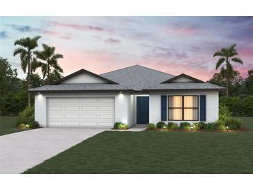 Charming single-story home with a manicured lawn, two-car garage, and tasteful landscaping at 5521 Colfax Ter, Port Charlotte, FL 33981