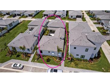Stunning aerial view of pristine, modern single Gathering home with perfectly manicured landscaping at 5910 Red Mangrove Ln, Bradenton, FL 34210