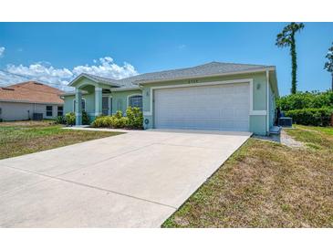 Charming single-story home with a well-maintained lawn and a spacious two-car garage at 2759 Starview Ave, North Port, FL 34288
