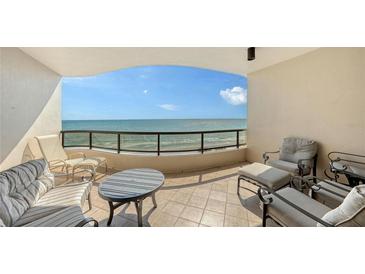 Inviting outdoor balcony with ocean views and comfortable seating at 435 L Ambiance Dr # K506, Longboat Key, FL 34228
