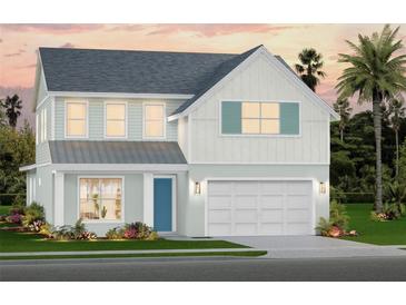 Charming two-story home featuring a two-car garage, tasteful landscaping and a welcoming light blue front door at 659 Maldives Trl, Sarasota, FL 34234