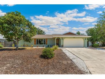 Charming single-story home with an attached garage, lush landscaping, and inviting curb appeal at 6708 11Th Nw Ave, Bradenton, FL 34209