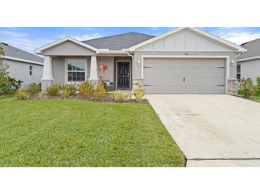 Charming one-story home featuring well-kept lawn, neutral color scheme, and a two-car garage at 6708 162Nd E Pl, Parrish, FL 34219