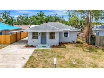 Charming single-story home with a well-maintained lawn and a welcoming front entrance at 609 25Th W Ave, Bradenton, FL 34205