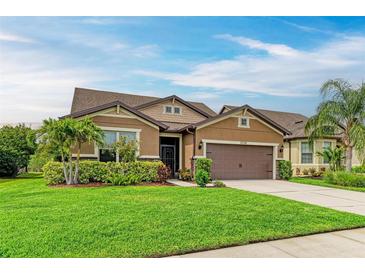 Inviting single-Gathering home with manicured lawn and mature landscaping at 10708 52Nd E Ct, Parrish, FL 34219