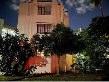 Charming vintage building featuring detailed architectural design and lush landscaping at 210 N 17Th W St # 15, Bradenton, FL 34205