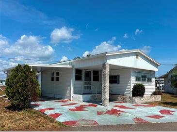 Charming single-story home with a covered entrance and cozy front yard, perfect for relaxed living at 237 Blackburn Blvd, North Port, FL 34287