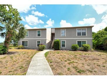 Beautiful two-story building with well-maintained landscaping and inviting walkway at 383 Bobby Jones Rd # 383, Sarasota, FL 34232