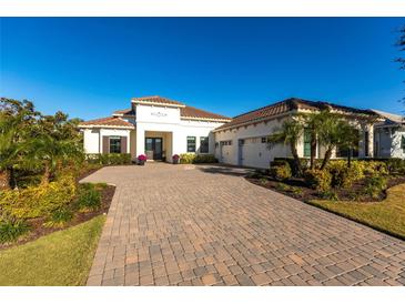Beautiful single-Gathering home with a paver driveway and a well-manicured lawn in a desirable neighborhood at 7208 Prestbury Cir, Bradenton, FL 34202