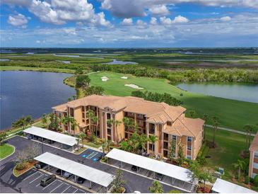 Stunning condo overlooking a meticulously maintained golf course and tranquil lake views at 8105 Grand Estuary Trl # 105, Bradenton, FL 34212