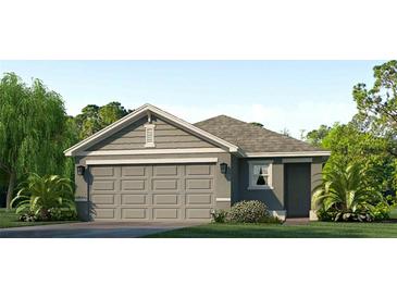 Charming one-story home featuring a gray exterior, two-car garage, and lush landscaping at 12031 Lansing Gln, Parrish, FL 34219