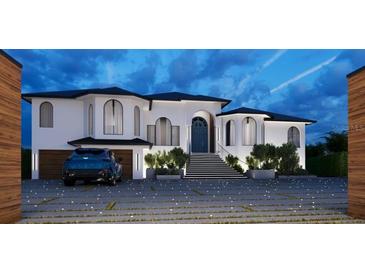 Stunning exterior view of a two-story home with a black roof, blue front door, and a 3-car garage at 1384 Harbor Dr, Sarasota, FL 34239