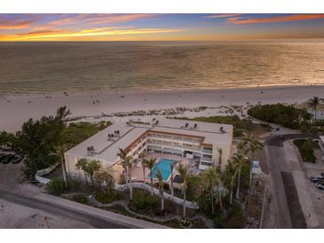 Beautiful beachside condos featuring a community pool and easy access to the pristine sandy beach and ocean at 4200 Gulf Dr # 104, Holmes Beach, FL 34217