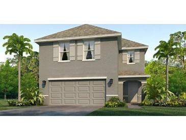 New construction two-story home featuring a two-car garage and well-maintained landscaping at 10722 Hidden Banks Gln, Parrish, FL 34219