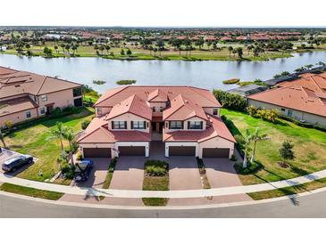 Beautiful two-story home with a red tile roof, three-car garage and scenic waterfront views at 10820 Tarflower Dr # 202, Venice, FL 34293