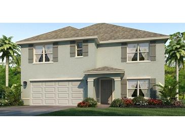 Charming two-story home with a well-manicured lawn and an attached two-car garage at 10841 Gentle Current Way, Parrish, FL 34219