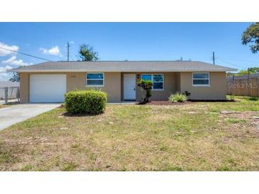 Charming single-story home featuring a well-maintained lawn and a one-car garage at 1533 Olympia Rd, Venice, FL 34293