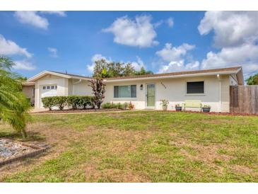Charming single-story home with a well-maintained lawn, white exterior, and a welcoming front entrance at 2402 33Rd W St, Bradenton, FL 34205