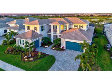 Stunning home with a paver driveway, meticulous landscaping, and a three-car garage at 8272 Redonda Loop, Bradenton, FL 34202