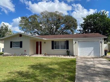 Charming single-story home with a well-manicured lawn and classic curb appeal at 3231 Cambridge Dr, Sarasota, FL 34232