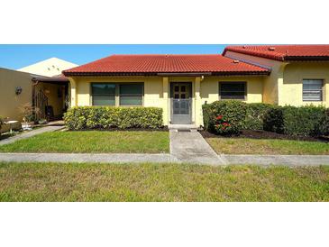 Charming single-story home with red tile roof and well-maintained landscaping at 1314 57Th W St # 1314, Bradenton, FL 34209