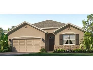 Charming single-story home featuring a two-car garage, stone accents, and manicured front lawn at 18305 Canopy Pl, Lakewood Ranch, FL 34211
