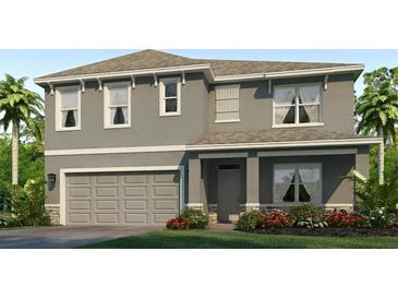 Beautiful two-story home with a two-car garage and well-maintained landscaping at 18313 Canopy Pl, Lakewood Ranch, FL 34211