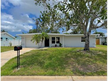 Charming single-story home features a well-manicured lawn and a classic mailbox at 1902 24Th W Ave, Bradenton, FL 34205