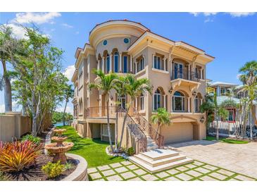 Stunning Mediterranean-style home with a multi-level design, grand staircase and beautiful landscaping at 290 N Washington Dr, Sarasota, FL 34236