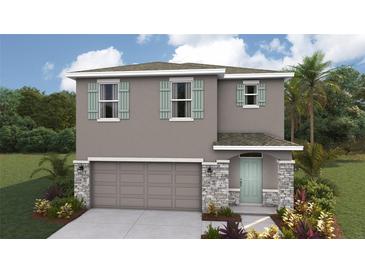 Charming two-story home showcasing a landscaped yard, two-car garage, and stylish shutter accents at 3214 Bitterroot Ln, Lakewood Ranch, FL 34211