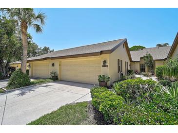 Charming single-story home featuring a two-car garage, well-maintained landscaping, and a spacious driveway at 7118 Lakeside Dr # 7118, Sarasota, FL 34243
