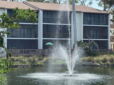 Lovely view of the condo exterior overlooking the water feature at 1170 Bird Bay Way # 206, Venice, FL 34285