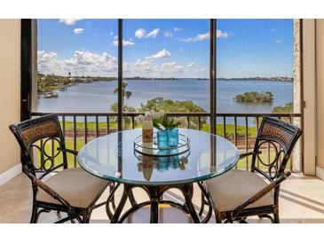 Cozy breakfast nook on balcony with breathtaking water view at 1608 Stickney Point Rd # 304, Sarasota, FL 34231
