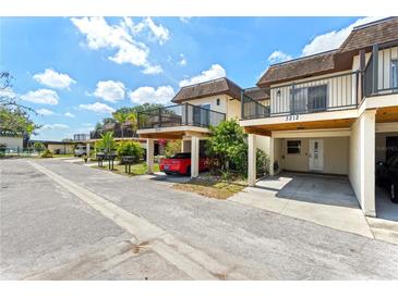 Charming townhomes with individual carports and balconies offer a community feel with private outdoor spaces at 3212 Ramblewood N Dr # 3212, Sarasota, FL 34237
