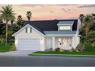 Charming single-Gathering home featuring a light-colored exterior, dormer window, and attached two-car garage at 651 Maldives Trl, Sarasota, FL 34234