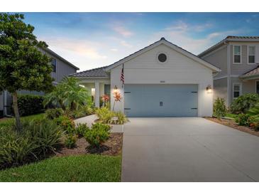 Charming single-story home with a well-manicured lawn and a welcoming two-car garage in a desirable neighborhood at 10120 Canaveral Cir, Sarasota, FL 34241