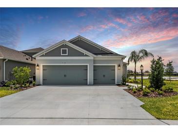 Charming single-Gathering home with a two-car garage and well-maintained landscaping at 4406 Rustling Pines Ter, Parrish, FL 34219