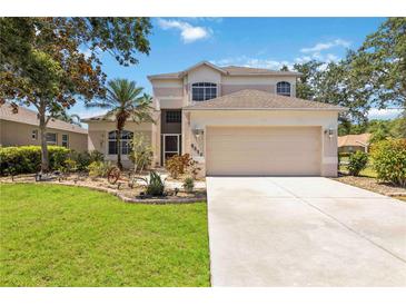 Charming two-story home with a well-maintained lawn, beautiful landscaping, and a two-car garage at 8222 Haven Harbour Way, Bradenton, FL 34212