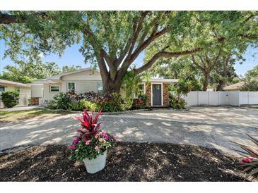 Charming single-story home with lush landscaping and a welcoming front entrance at 1019 S Tuttle Ave, Sarasota, FL 34237