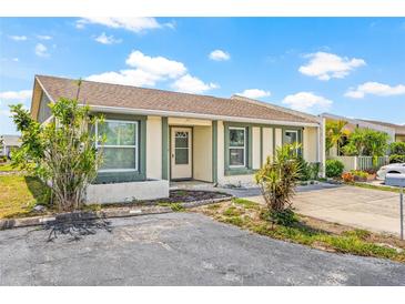 Charming single-story home with well-maintained landscaping and a cozy front entrance, under a blue sky at 3901 41St W St, Bradenton, FL 34205
