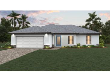 Charming single-story home featuring a two-car garage, a blue front door, and a well-manicured front lawn at 10547 Kidron Ave, Englewood, FL 34224