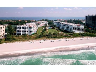 Beautiful beachfront condo buildings offer stunning views and private beach access to residents at 1465 Gulf Of Mexico Dr # 502, Longboat Key, FL 34228
