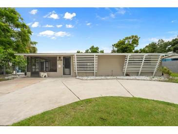 Charming single-story home featuring a minimalist front yard and modern architectural details at 2015 Bayshore Gardens Pkwy, Bradenton, FL 34207