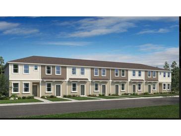 Modern townhouse complex featuring neutral toned exteriors, well-maintained landscaping, and inviting curb appeal at 16646 San Nicola Pl, Bradenton, FL 34211